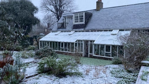 Monk's House, conservatory side and front beds with a light dusting of snow, winter 2025.
